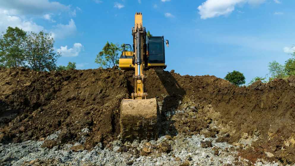 Excavator Performing Professional Excavating Services